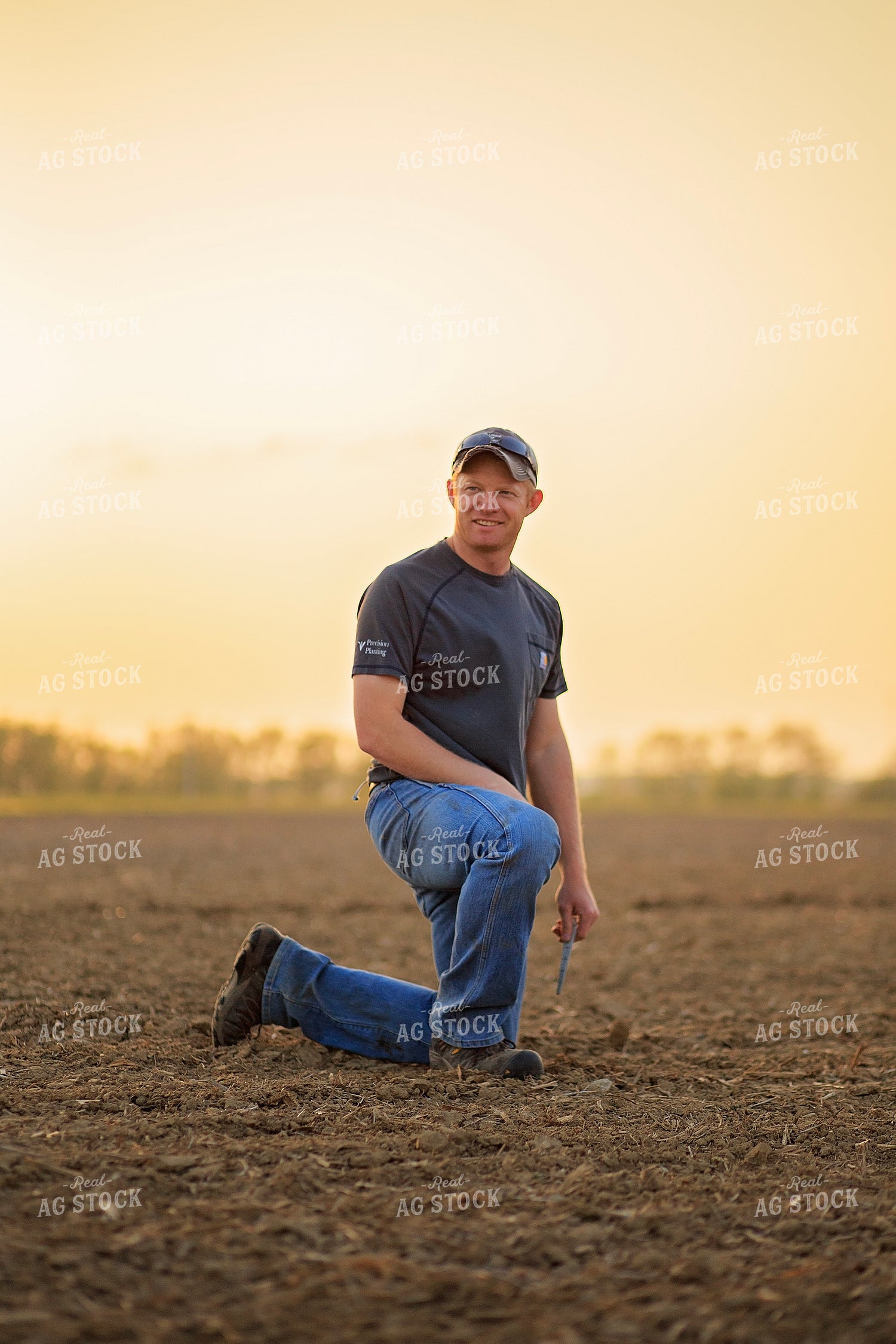 Farmer Checks Seed Depth After Planting 93201
