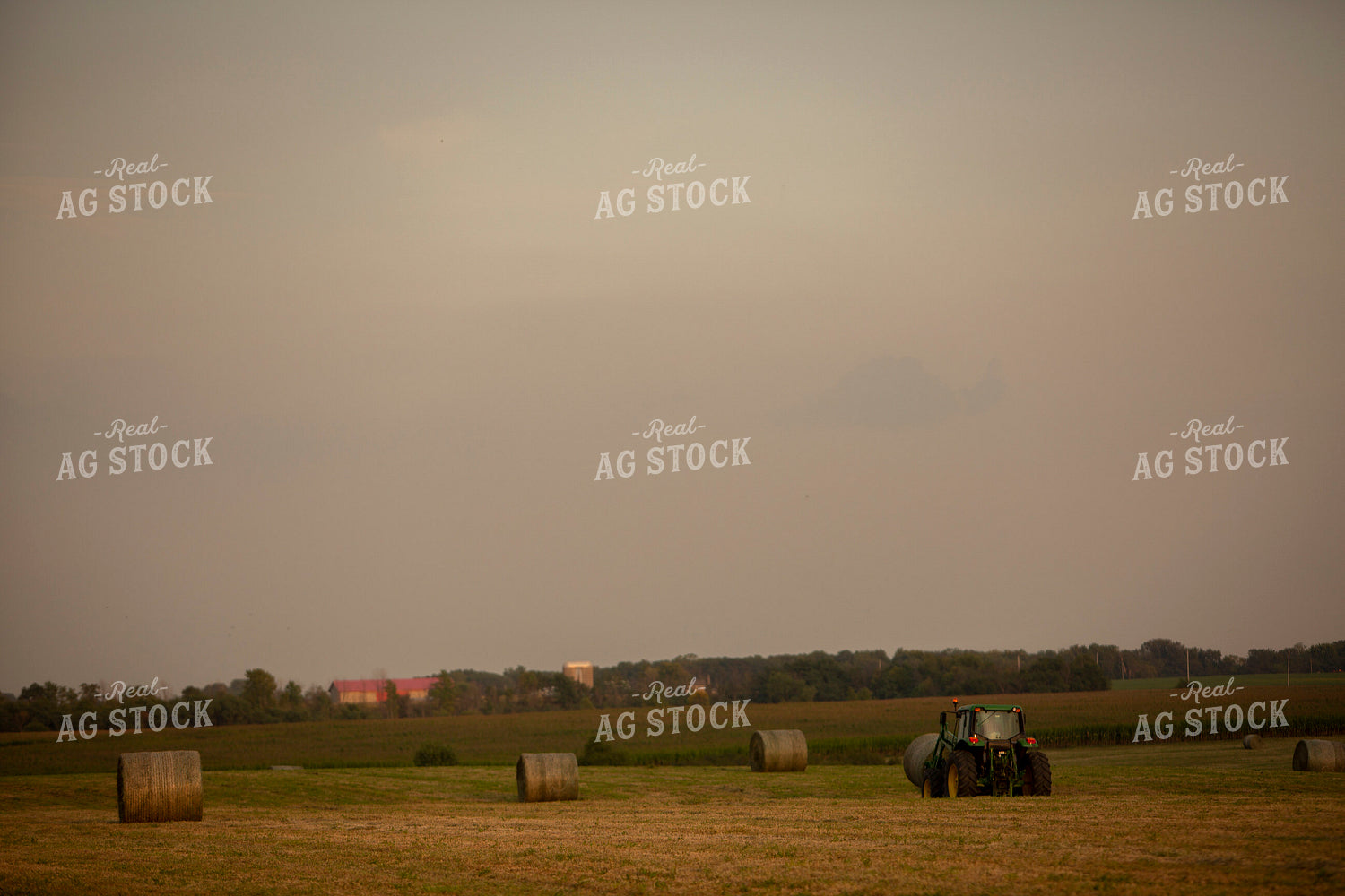 Tractor Lifting Round Hay Bale 5516