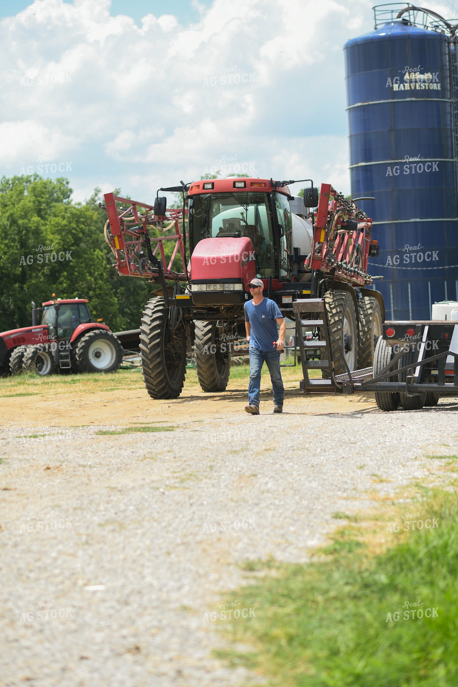 Farmer Walking by Sprayer 191228