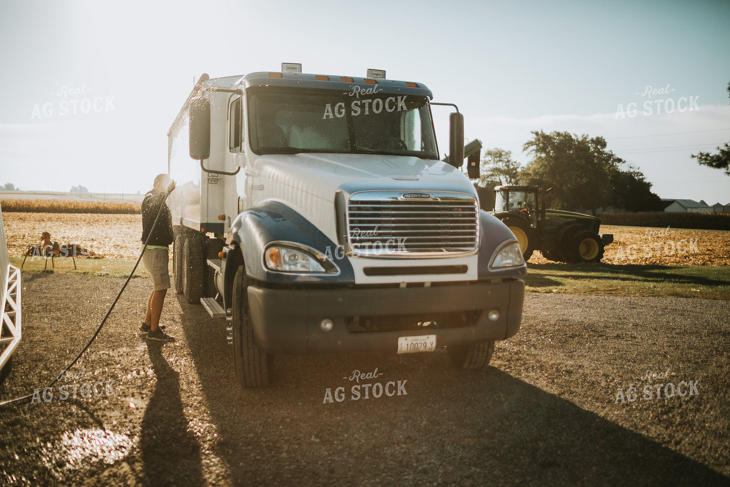 Farmer Hosing off Tandem Farm Truck 4666