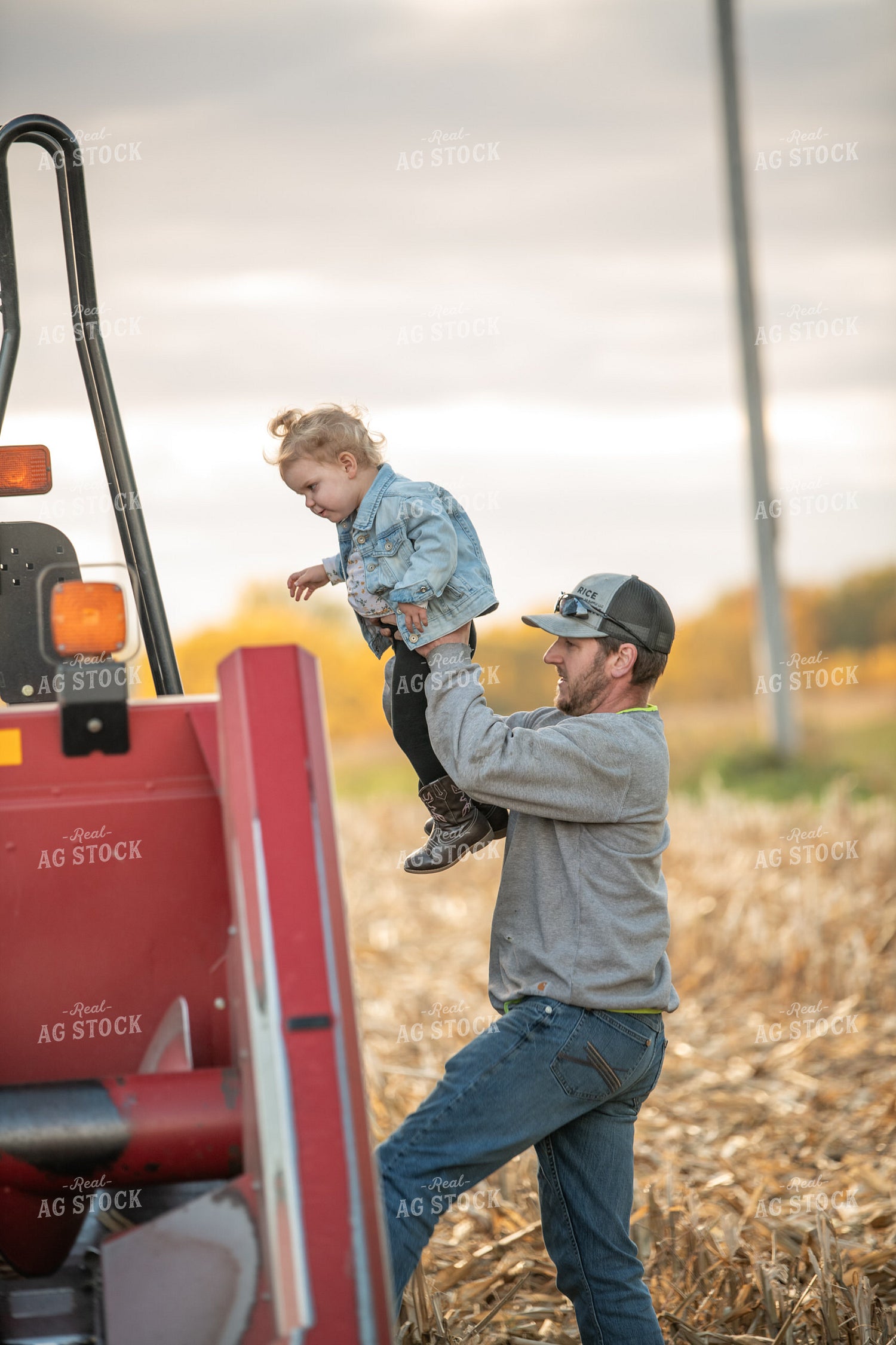 Farmer and Kid Climbing into Combine 76550