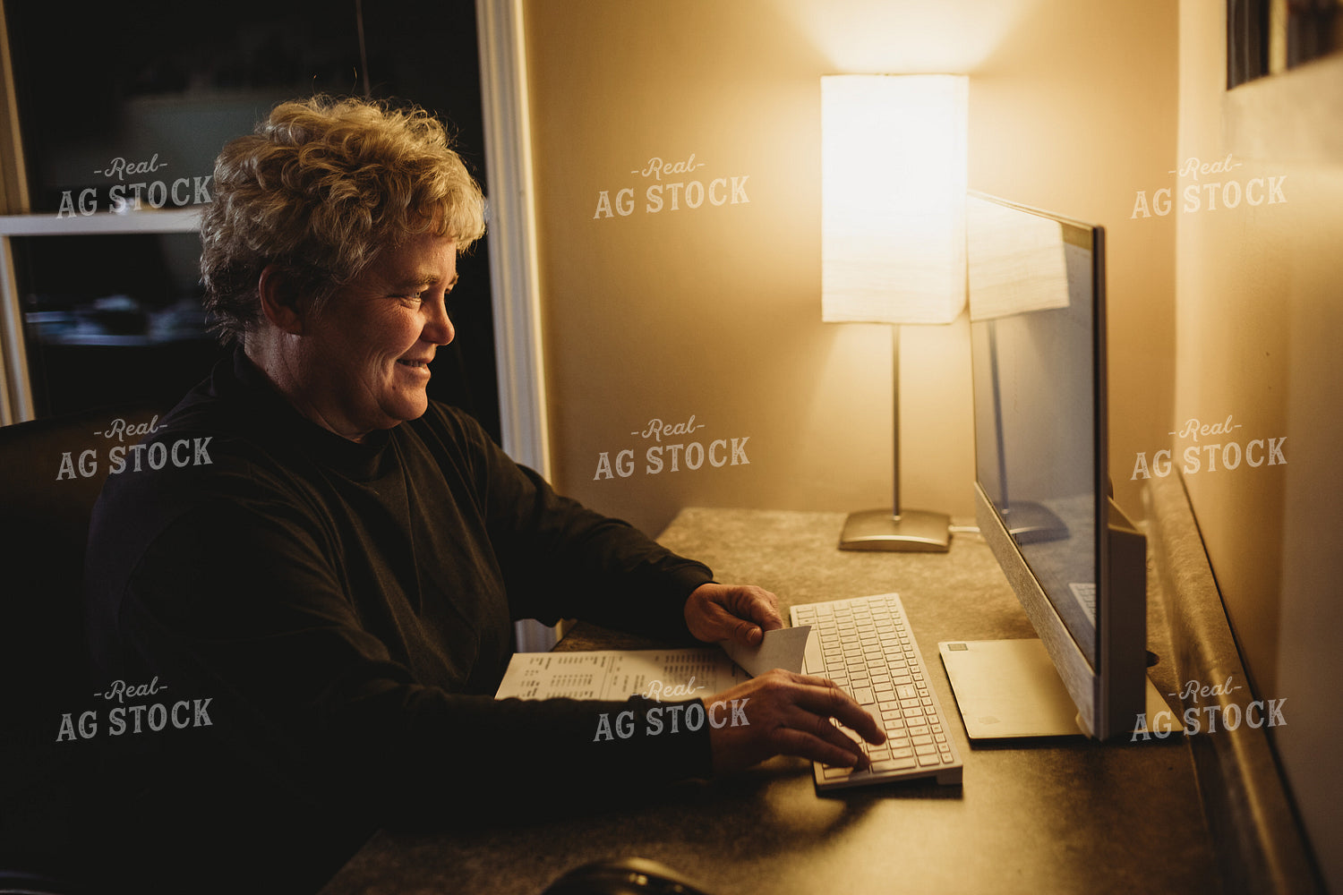 Farmer Using Computer for Farm Accounting 3709