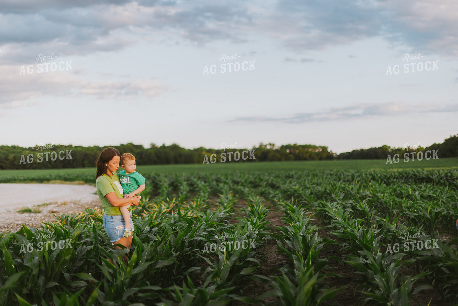 Female Farmer and Son Checking Corn 8780