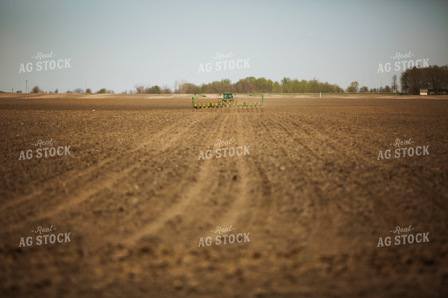 Tractor Pulling Planter in Field 6364