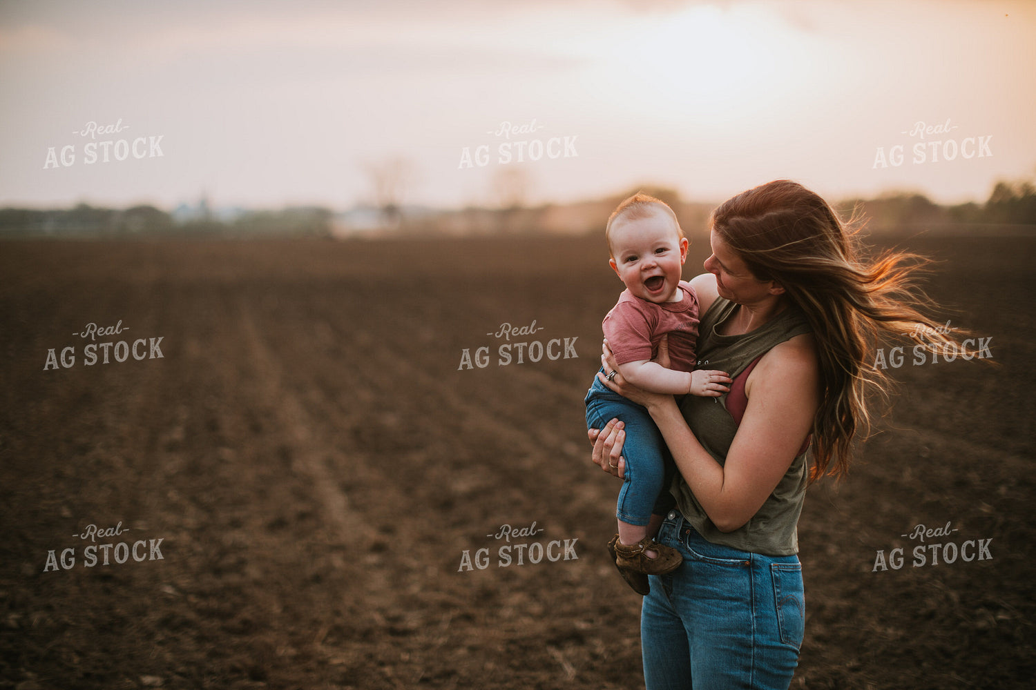 Farm Mom with Farm Kid in Field During Planting 5705