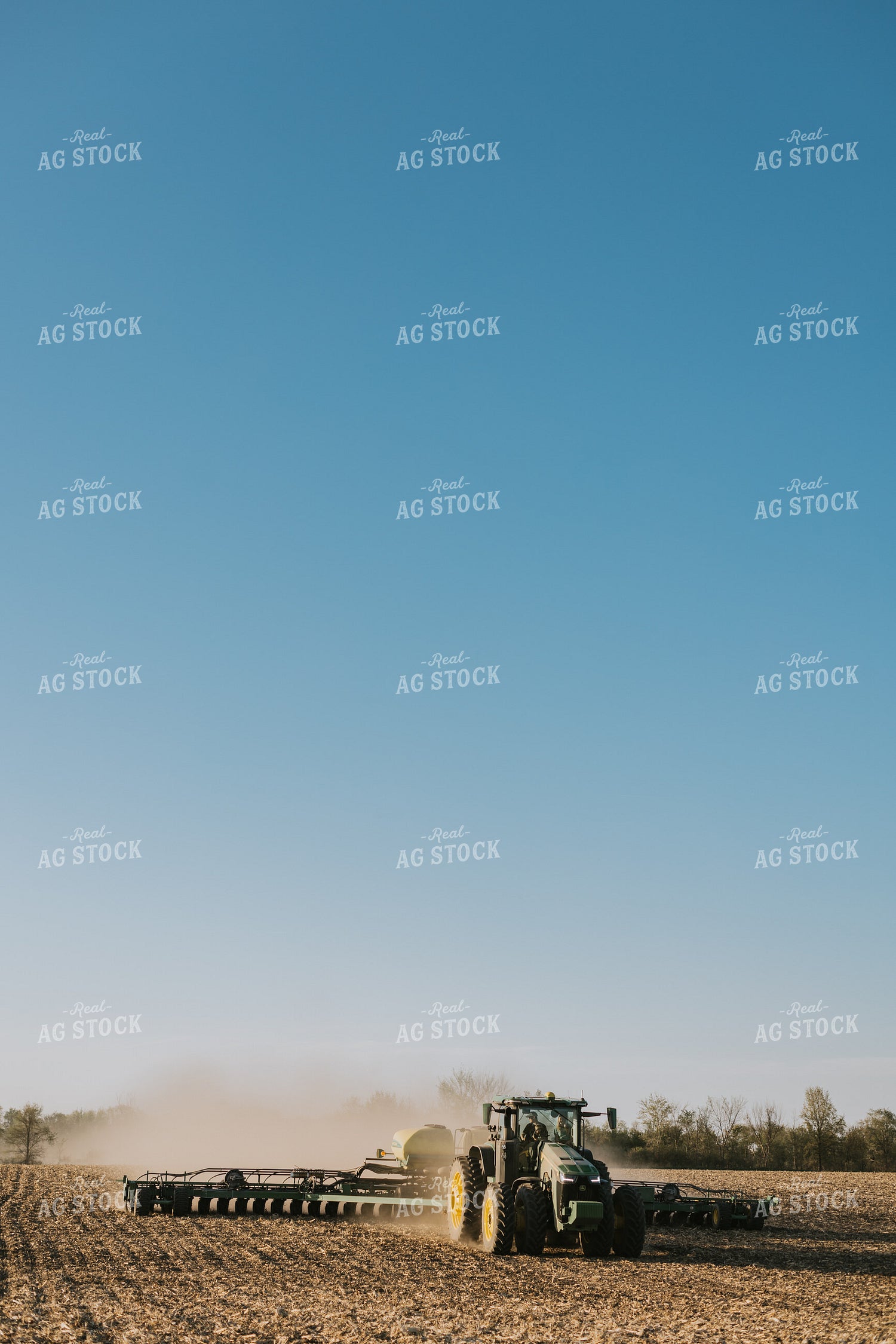 Tractor Planting Field While Child Sits on Farmer's Lap 7670