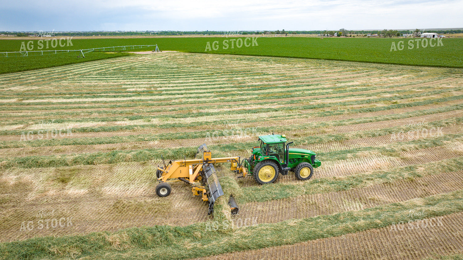 Tractor with Merger in Hay Field 56414
