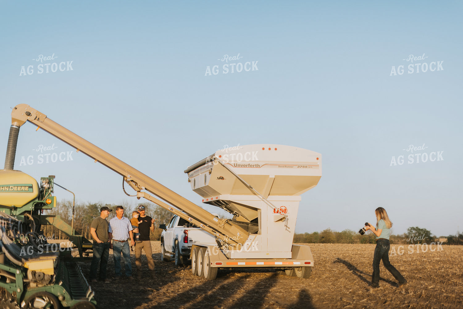 Farm Wife Takes Pictures of Farmers Next to the Planter and Seed Tender 7706