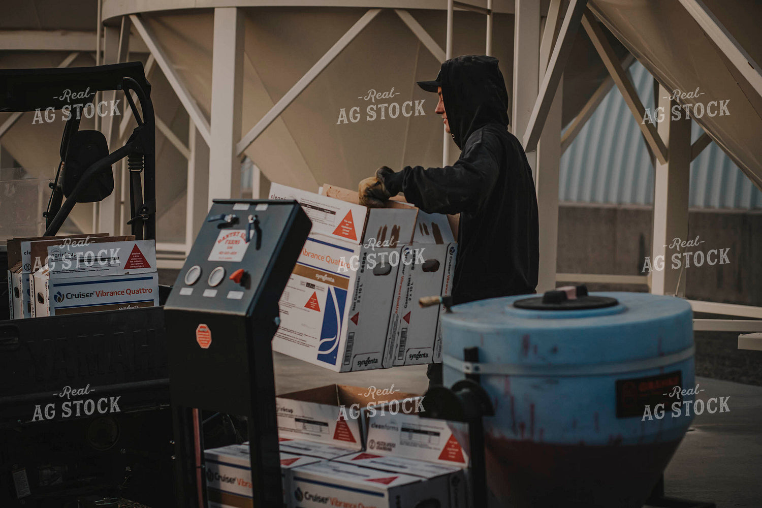 Farmer Moves Seed Treatment Boxes 135011