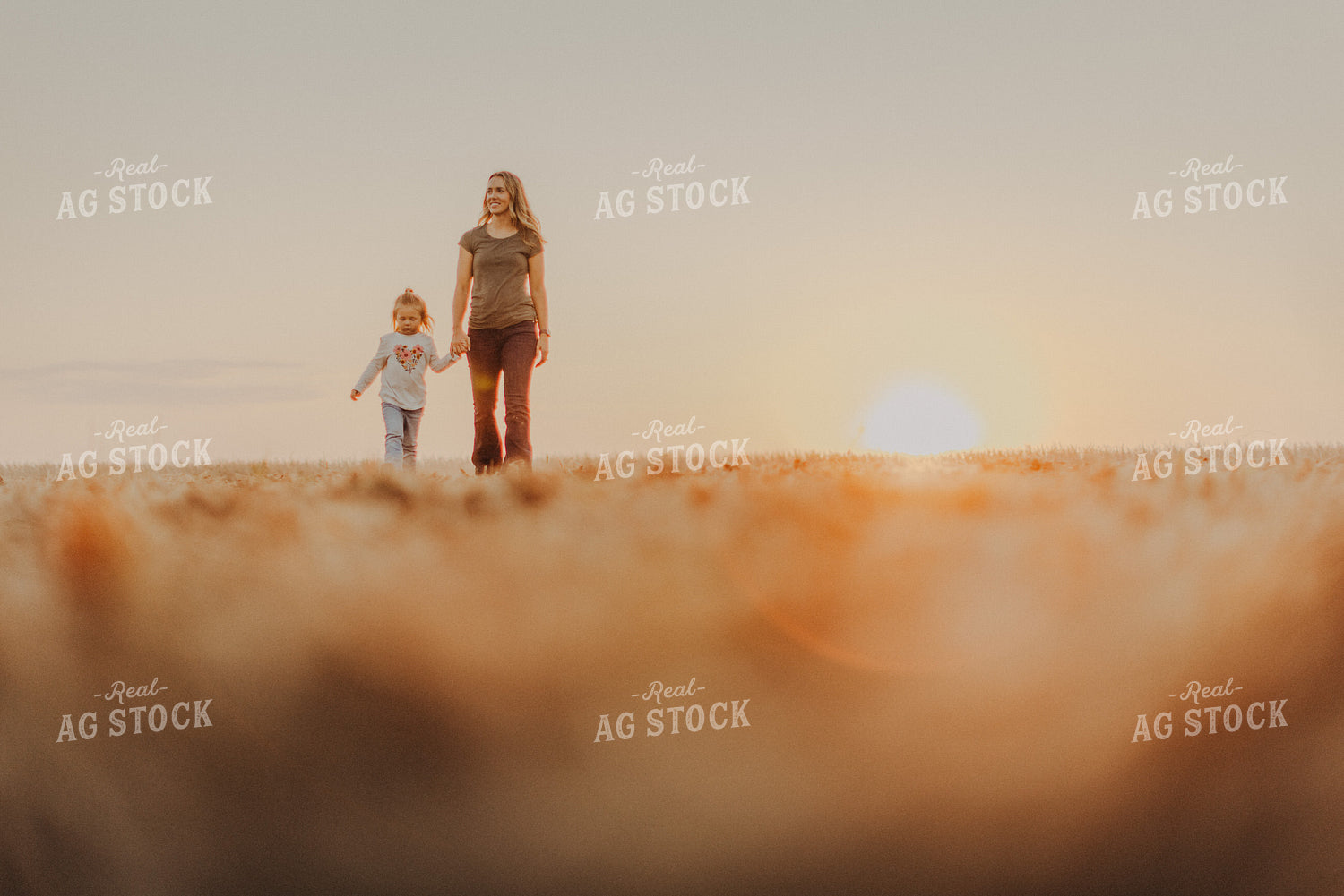 Farm Wife Walking with Daugher in Field 9269