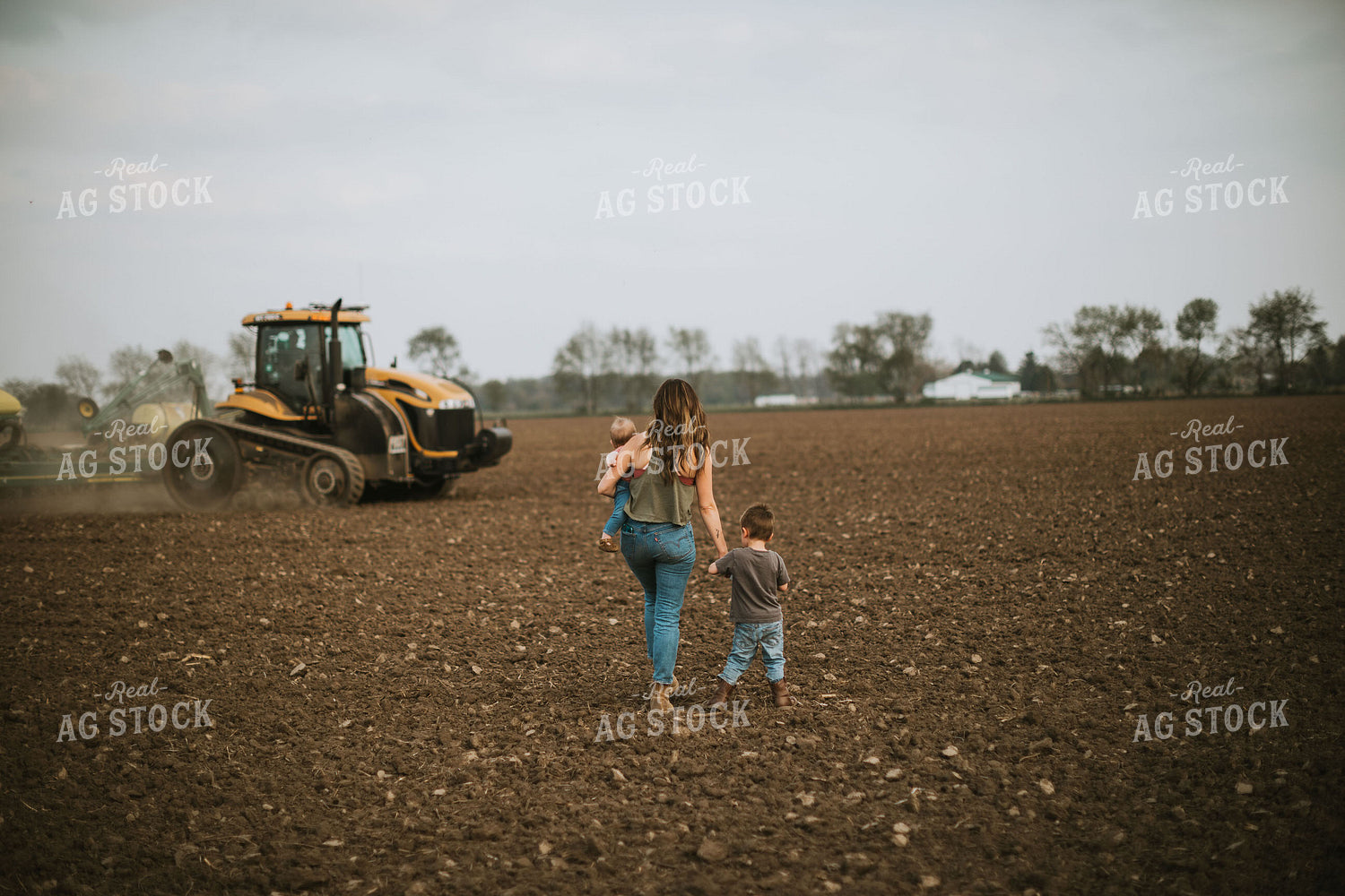 Farm Mom Taking Kids Out to Tractor During Planting 5636