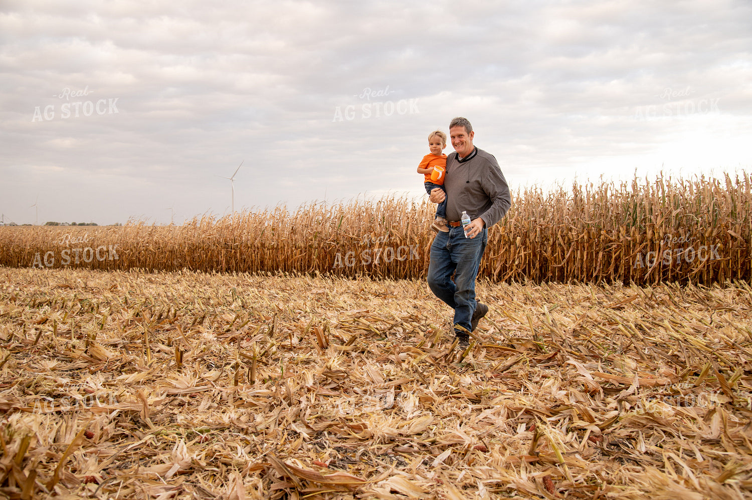 Grandson and Grandfather Farmer in Field 25830