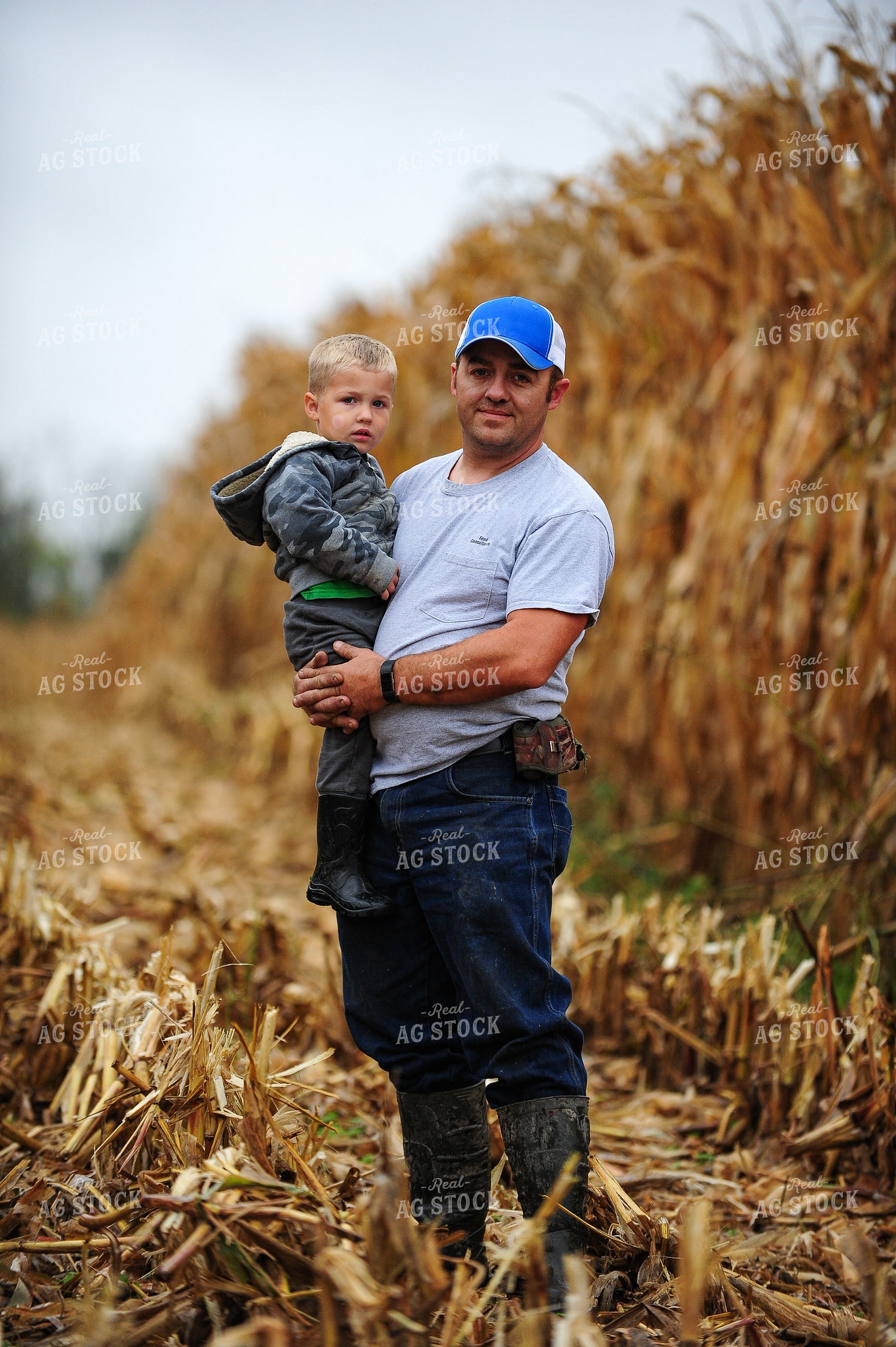 Farmer Holding Kid 168001