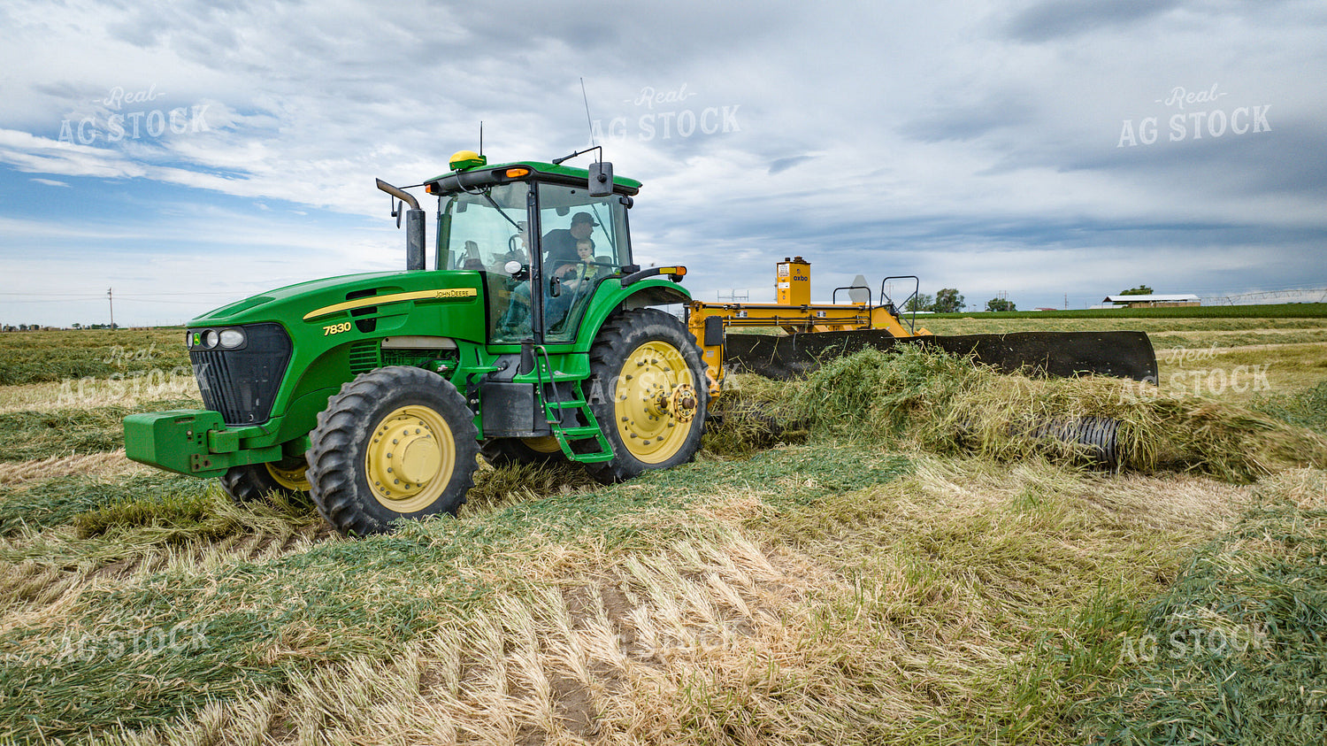 Tractor with Merger in Hay Field 56416