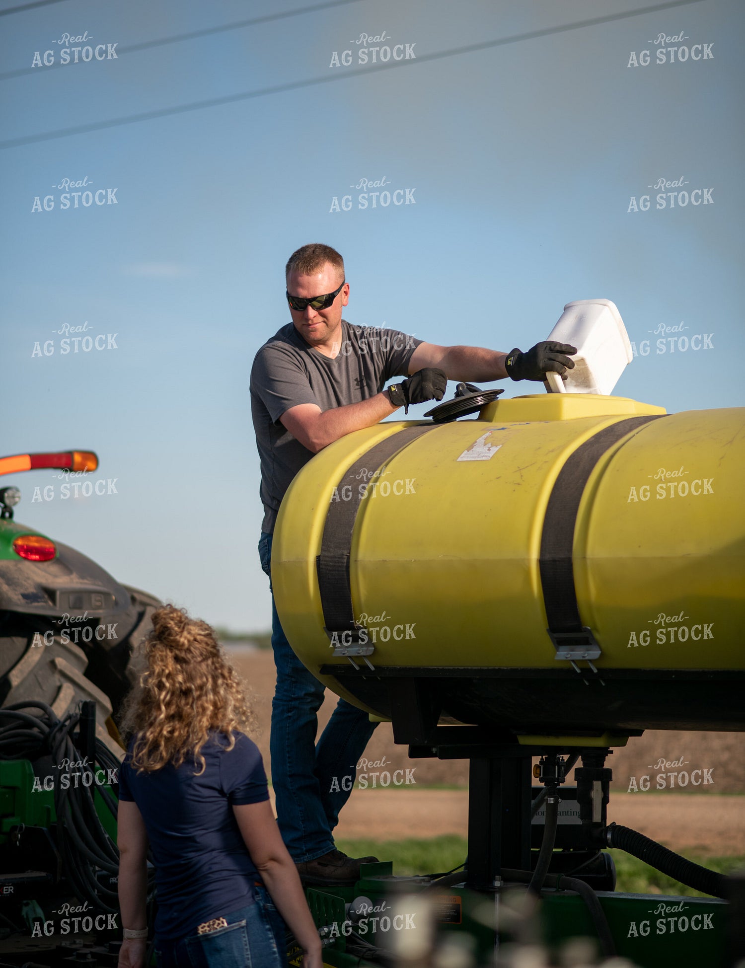 Farmer Filling Planter with Starter 76369