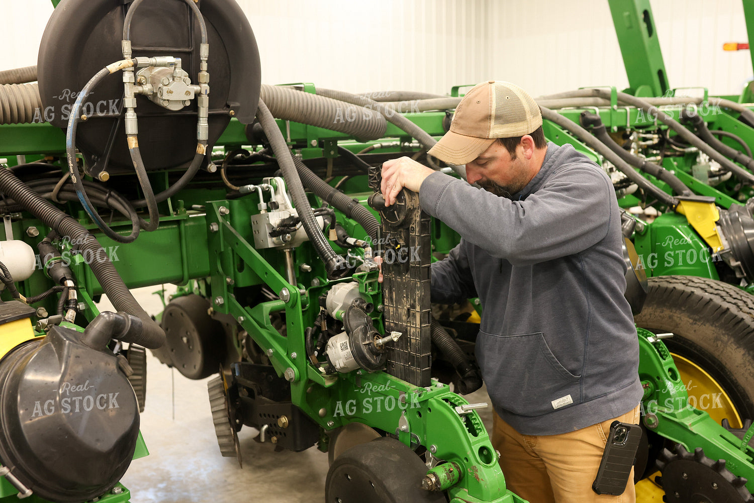 Farmer Fixing Planter 161117
