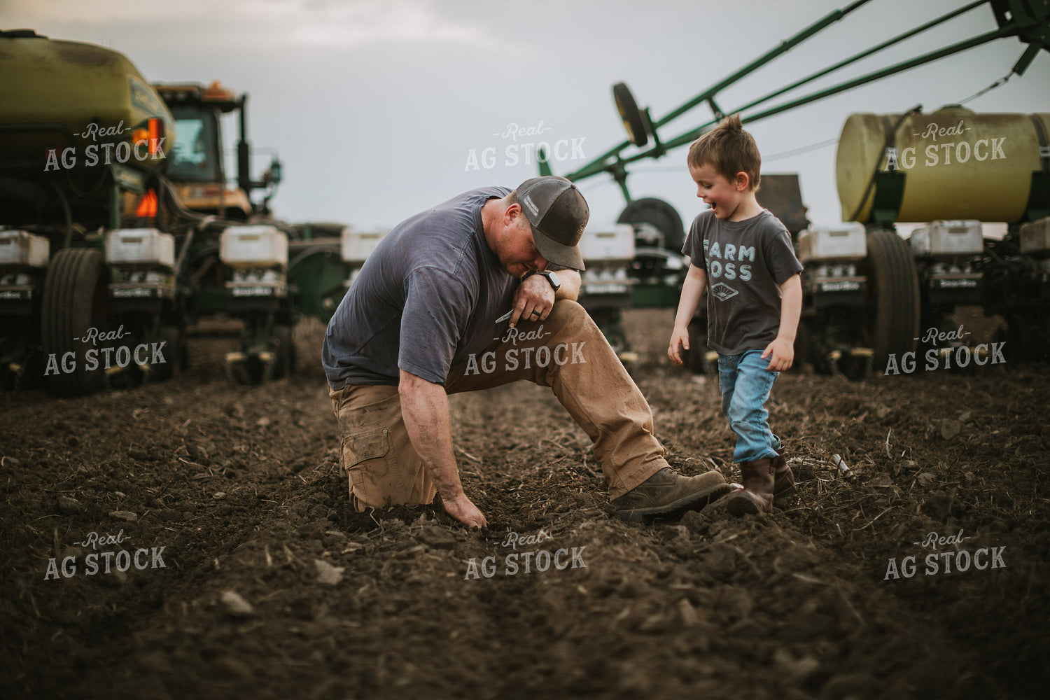 Farmer and Farm Kid Checking Seed Depth 5651