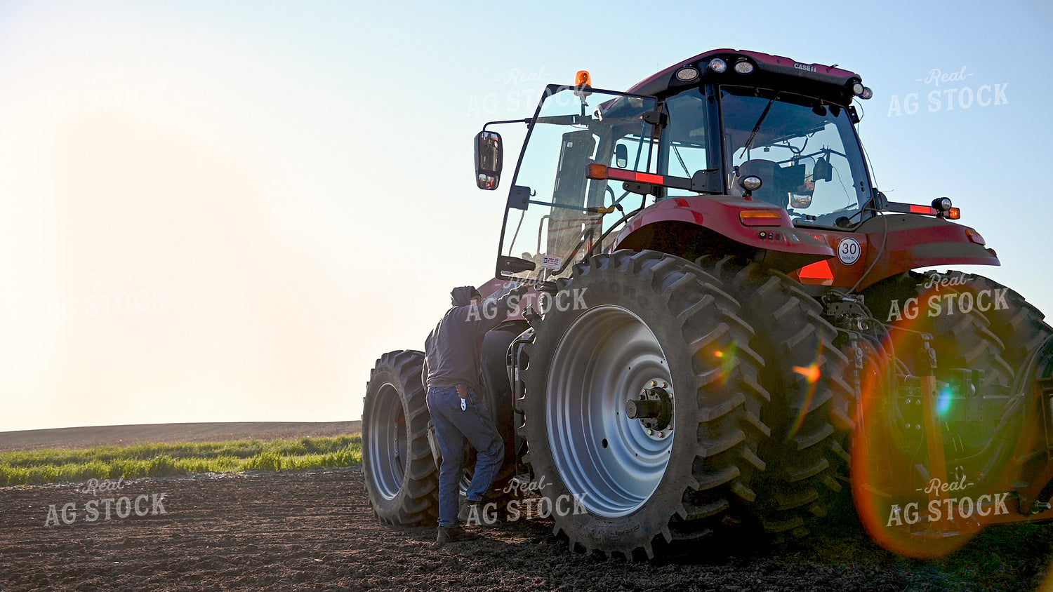 Farmer Climbing into Cab 25016