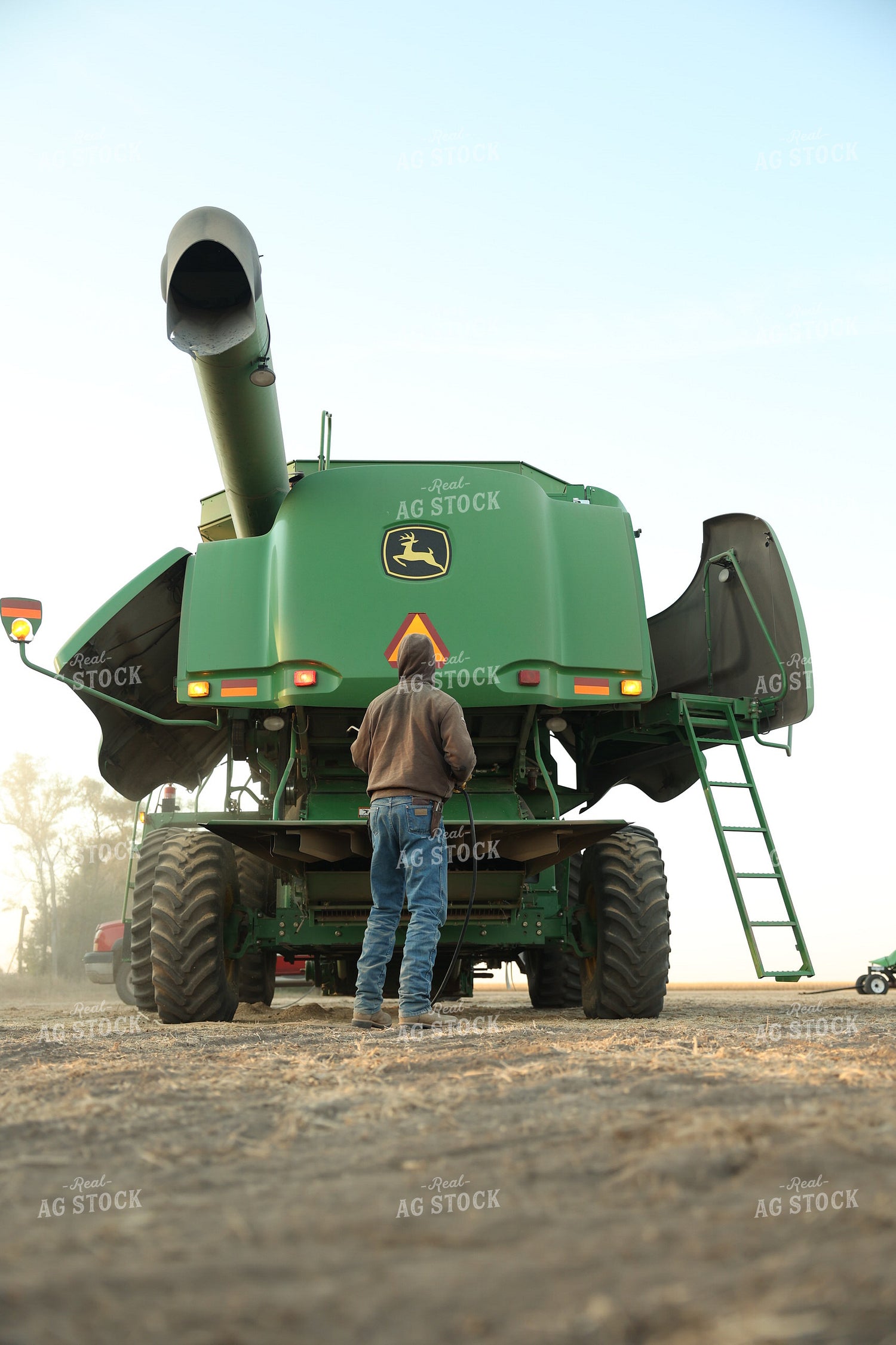 Farmer Blowing out Combine 114099