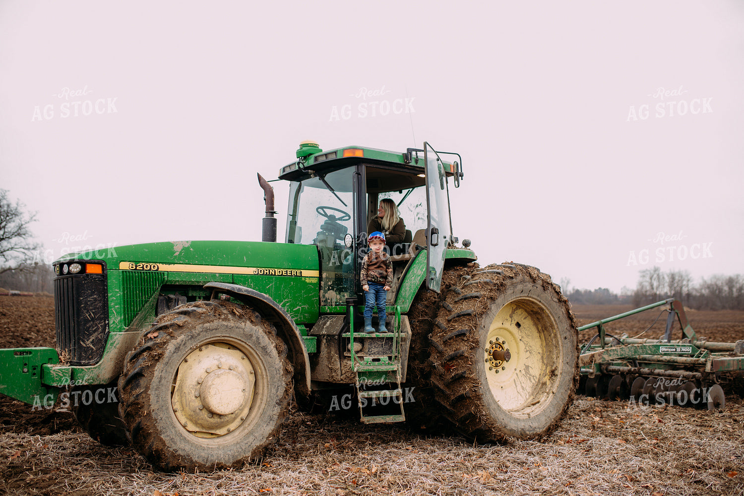 Farm Kid on Side of Tractor 169070