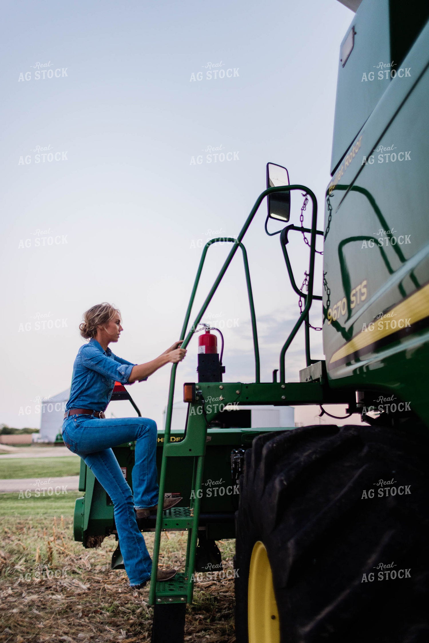 Female Farmer Climbing into Combine 8398