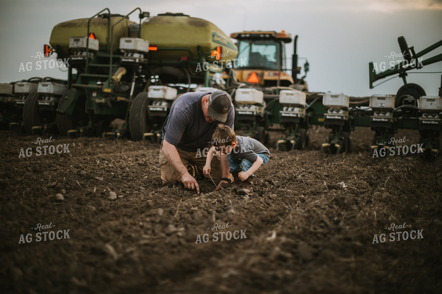 Farmer and Farm Kid Checking Seed Depth 5653