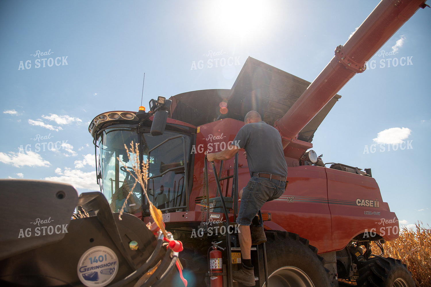 Farmer Climbing into Combine 25885