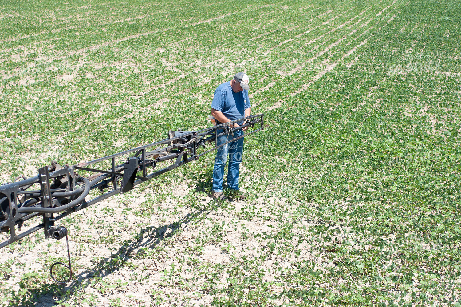 Farming Working on Sprayer Arm 103004
