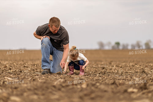 Farmer and Daughter Checking Soybeans 93306