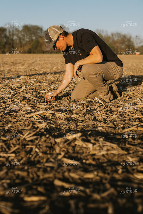 Farmer Checks Seed Depth After Planting 7680
