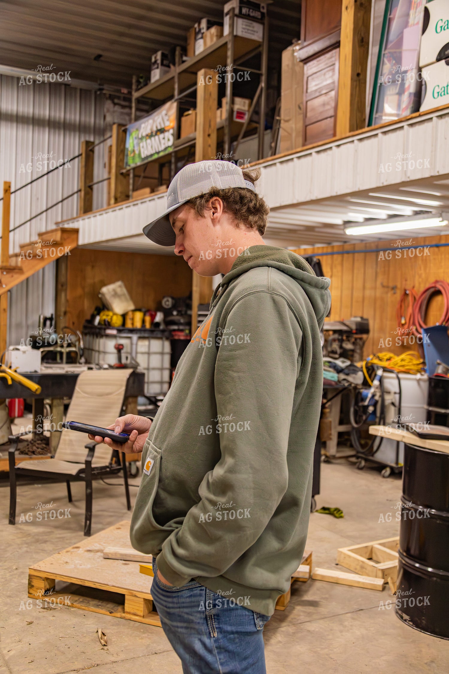 Farmer Using Phone in Shop 231119