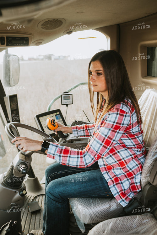 Female Farmer Driving Combine 3492
