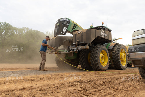 Farmer Cleaning Tractor 79870