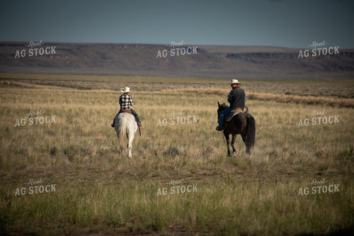Rancher and Ranch Kid on Horseback 78191