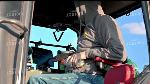Farmer in the Tractor Cab with Technology - 041