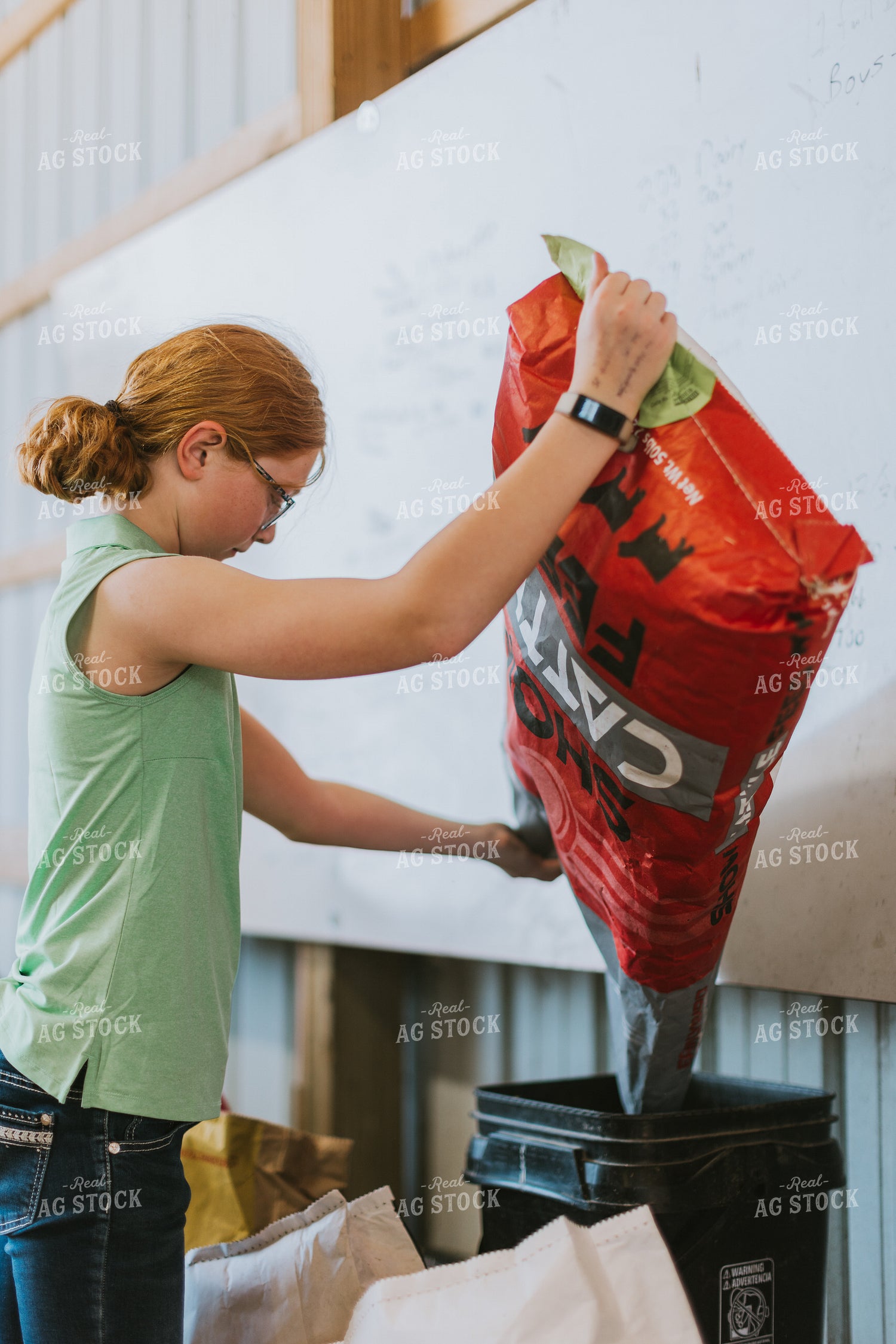 Farm Kid Pouring Feed 7858