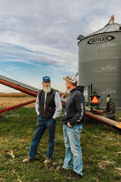 Farmers Talking by Grain Auger 115151