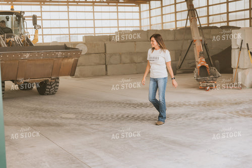 Woman Farmer Walks in Shed 7529
