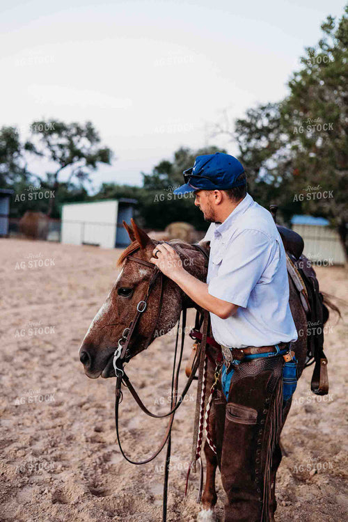Cowboy and Horse in Arena 281086