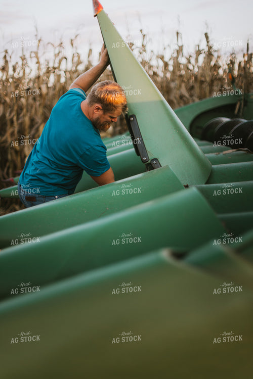 Farmer Fixing Combine Head 9391