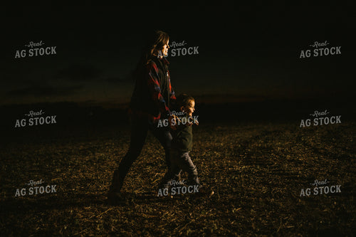 Farm Mom and Son Waiting for Tractor in Field at Night 5160