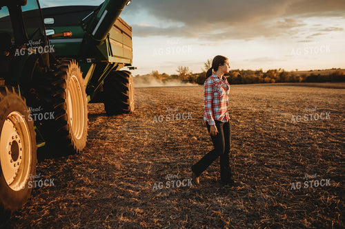 Female Farmer Climbing out of Tractor 3468