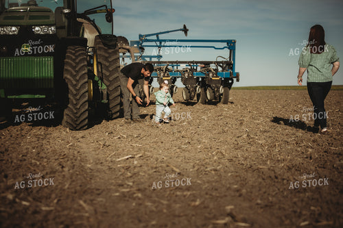 Farmer with Daughter Running to Mom in Field 4197