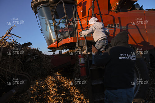 Farm Family Climbing Into Combine 26326