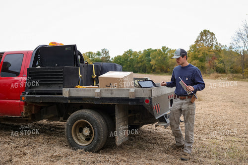 Farmer Near Bed of Truck 52570