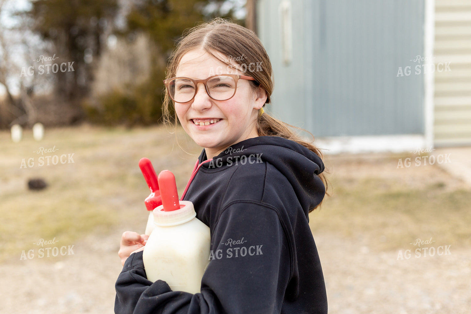 Farm Kid Carrying Calf Bottles 155375