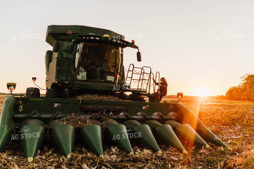 Farmer Climbing into Tractor 115135