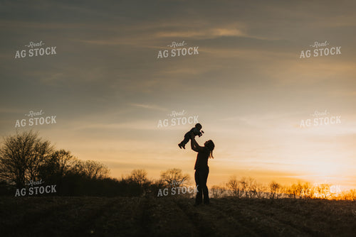Farmer Playing with Farm Kid in Field 7464