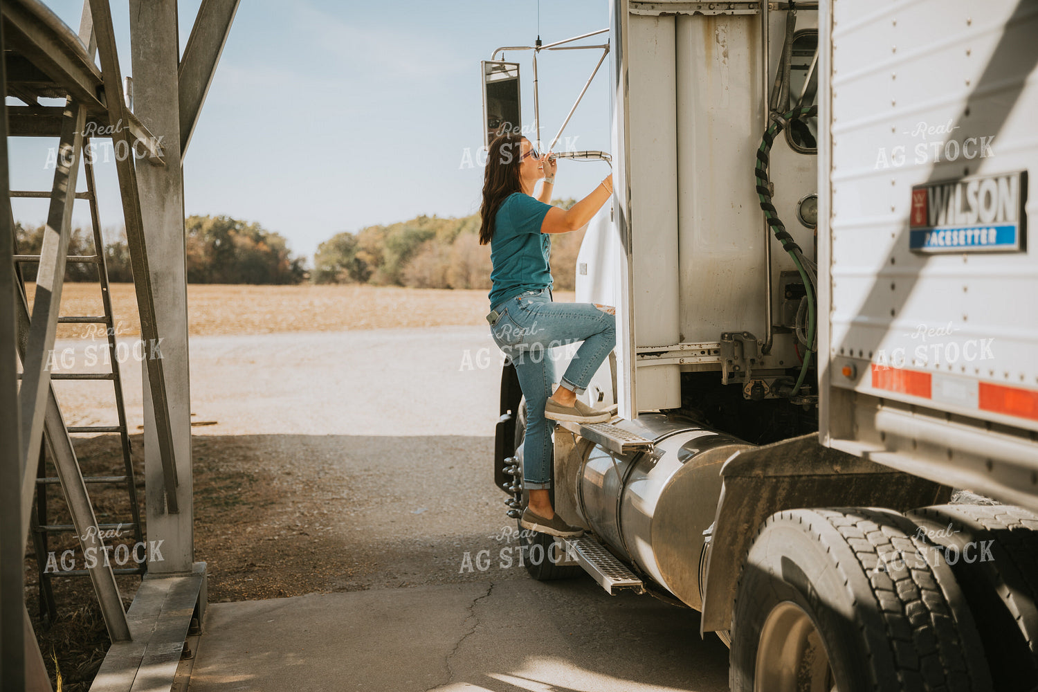 Female Farmer Getting in Semi Cab 7044