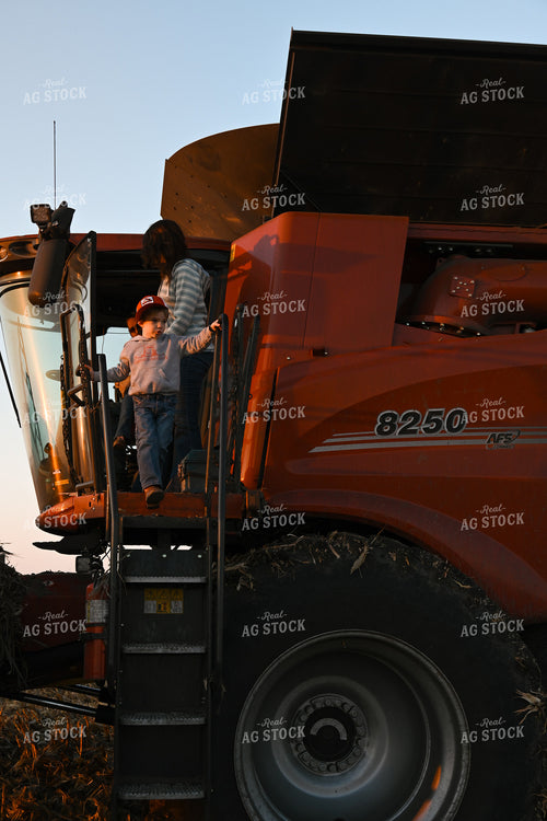 Farm Family Climbing Out of Combine 26302